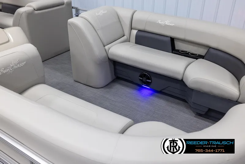 Slide: The Image of 2024 SunChaser Vista 22 LR boat interior with plush seating and blue LED lighting. - 10