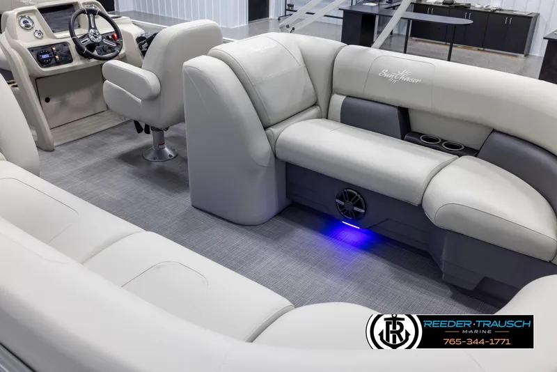 Slide: The Image of 2024 SunChaser Vista 22 LR pontoon boat interior with plush seating and modern dashboard. - 11