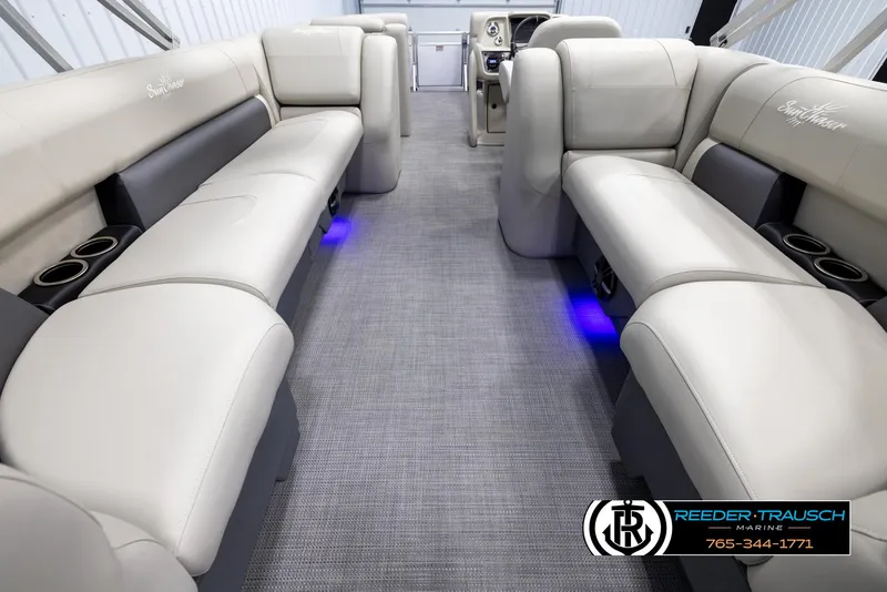 Slide: The Image of 2024 SunChaser Vista 22 LR interior with beige seating and blue LED lighting. - 16