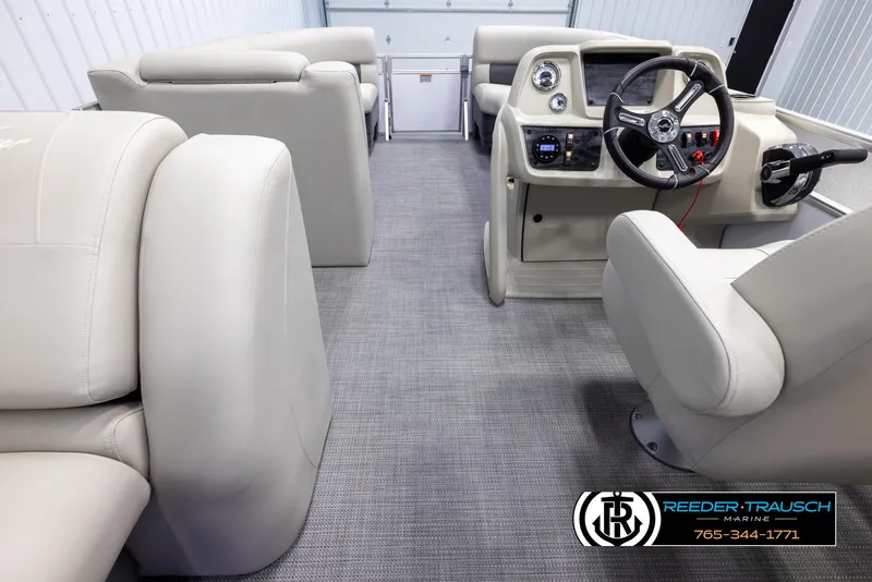 Slide: The Image of Interior of 2024 SunChaser Vista 22 LR pontoon boat with beige seating and modern dashboard. - 17