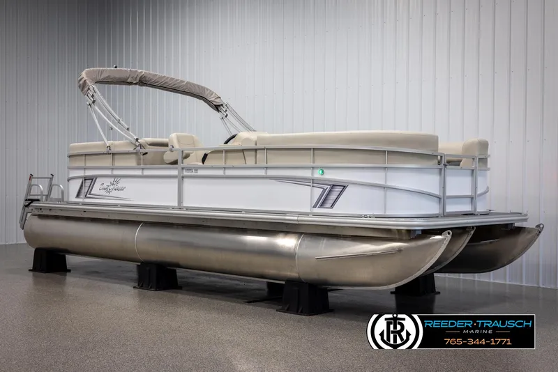 Slide: The Image of 2024 SunChaser Vista 22 LR pontoon boat in showroom. - 2