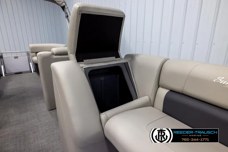 Slide: The Image of 2024 SunChaser Vista 22 LR boat interior with open storage compartment. - 21