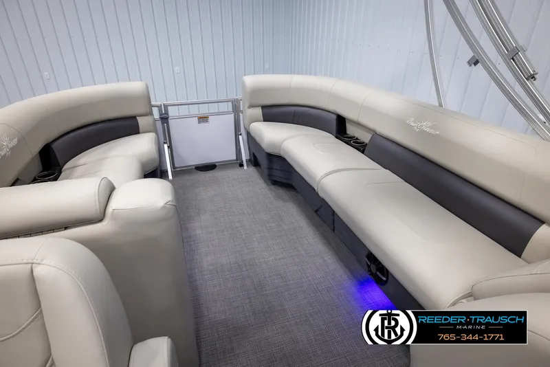 Slide: The Image of 2024 SunChaser Vista 22 LR pontoon boat interior with plush seating and modern design. - 22