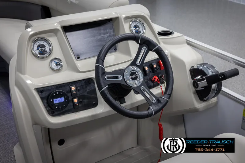 Slide: The Image of 2024 SunChaser Vista 22 LR boat dashboard with steering wheel and control panel. - 26