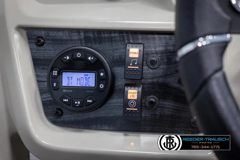 Slide: The Image of Control panel of 2024 SunChaser Vista 22 LR pontoon boat with stereo and light switches. - 28