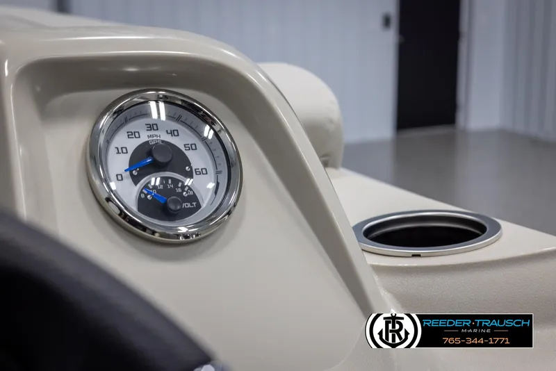 Slide: The Image of Close-up of 2024 SunChaser Vista 22 LR boat dashboard with speedometer and cup holder. - 30