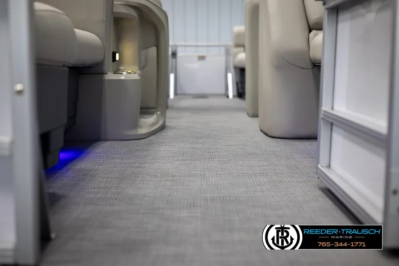 Slide: The Image of 2024 SunChaser Vista 22 LR interior with grey carpet and comfortable seating. - 39