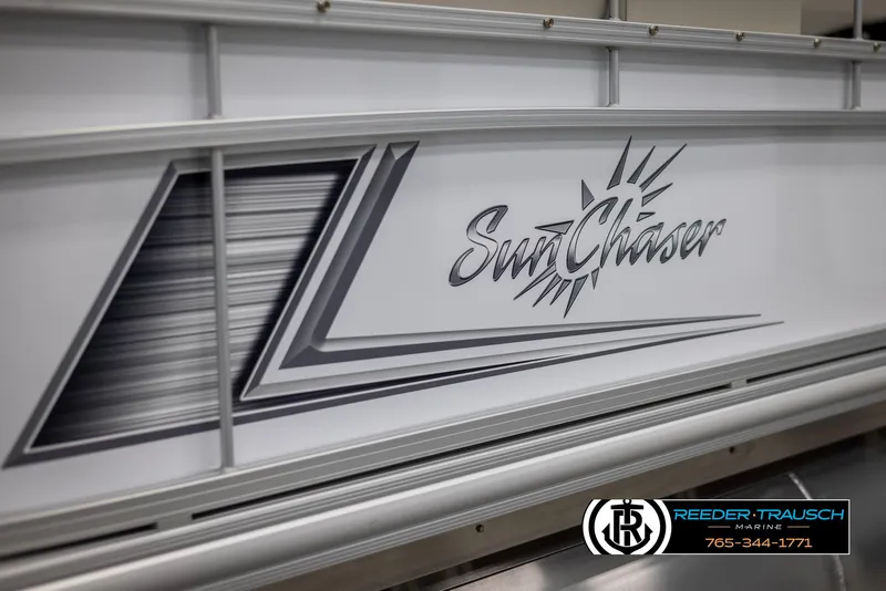 Slide: The Image of 2024 SunChaser Vista 22 LR pontoon boat side view with logo and dealership contact. - 42