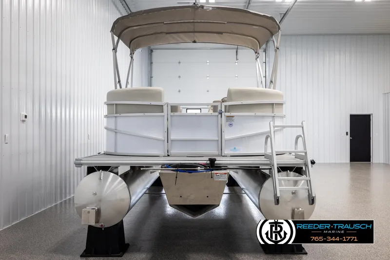 Slide: The Image of 2024 SunChaser Vista 22 LR pontoon boat in indoor storage. - 7