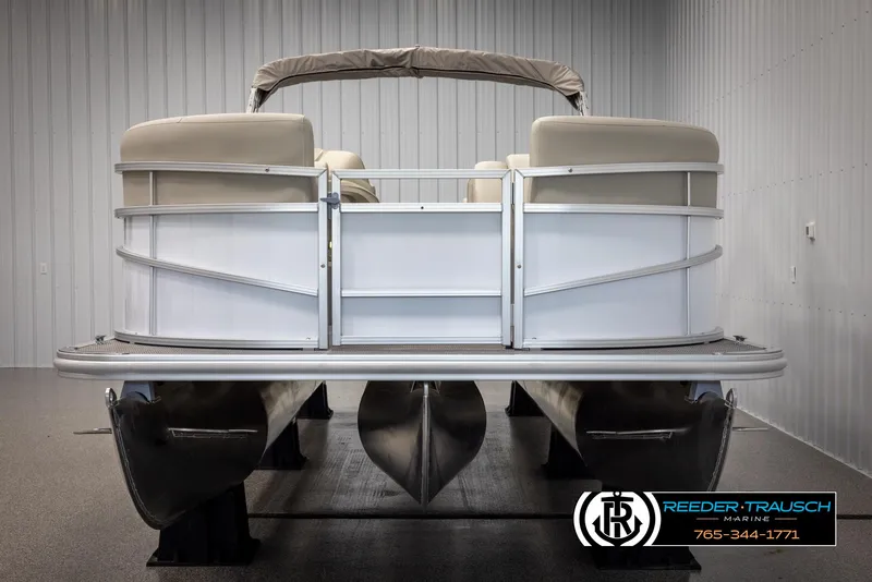 Slide: The Image of 2024 SunChaser Vista 22 LR pontoon boat in showroom, rear view. - 8