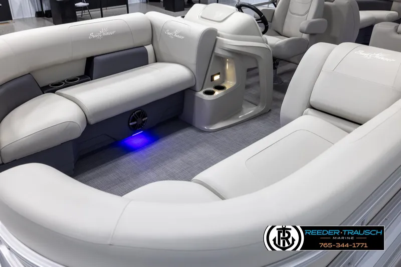 Slide: The Image of 2024 SunChaser Vista 22 LR pontoon boat interior with plush seating and ambient lighting. - 9