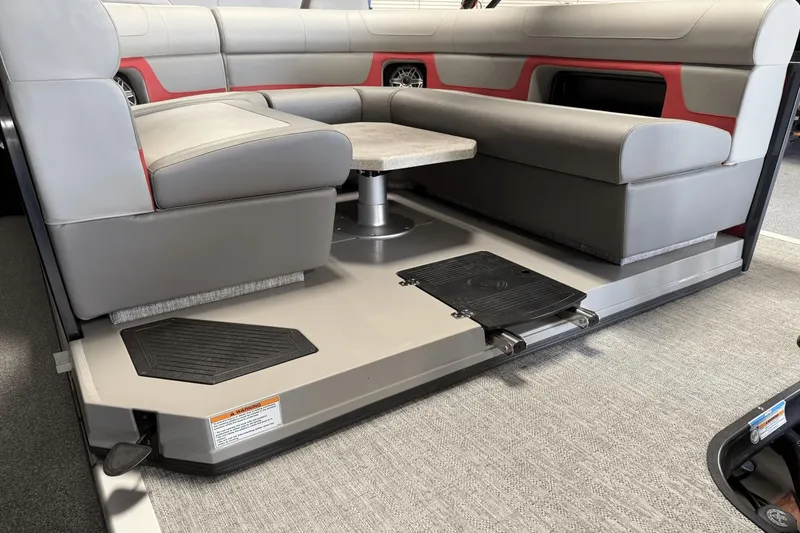 Slide: The Image of 2024 Premier 250 Solaris boat interior with gray seating and table. - 13