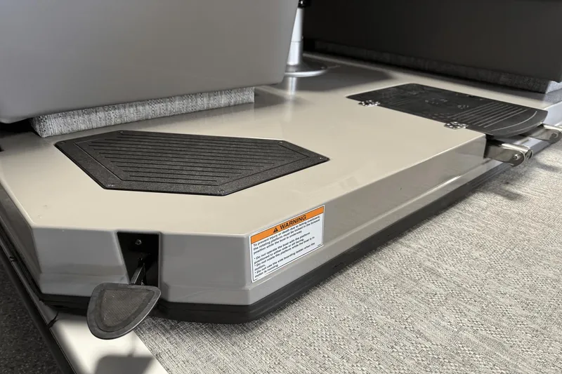 Slide: The Image of 2024 Premier 250 Solaris boat deck with non-slip mats and safety warning label. - 14
