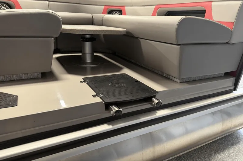 Slide: The Image of 2024 Premier 250 Solaris interior seating with table and storage compartment. - 16