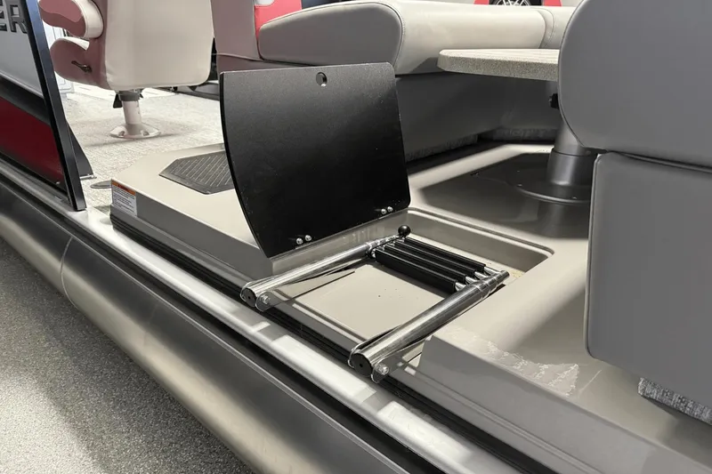 Slide: The Image of 2024 Premier 250 Solaris boat interior with foldable ladder and seating. - 17