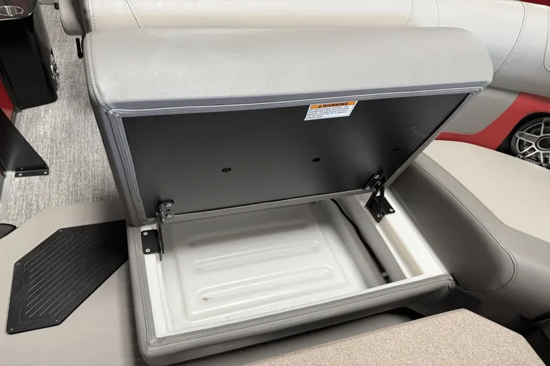 Slide: The Image of Open storage compartment in 2024 Premier 250 Solaris boat seat. - 21