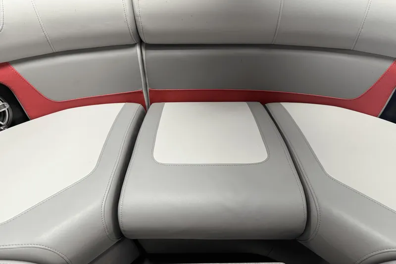 Slide: The Image of 2024 Premier 250 Solaris boat seating with gray and red upholstery. - 22