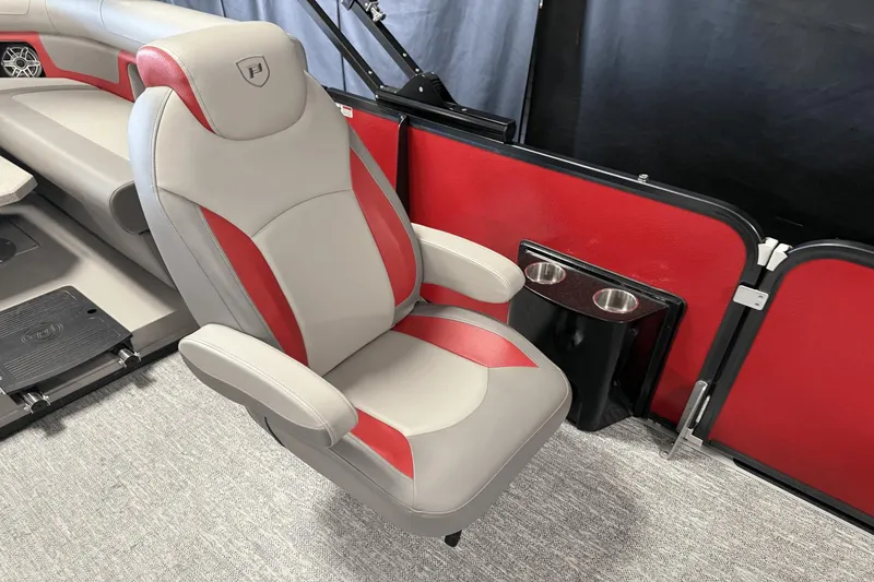 Slide: The Image of 2024 Premier 250 Solaris boat interior with red and gray seating and cup holders. - 25