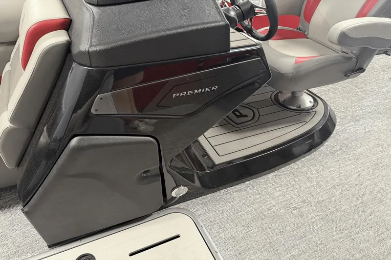 Slide: The Image of 2024 Premier 250 Solaris boat interior with steering console and seating. - 29