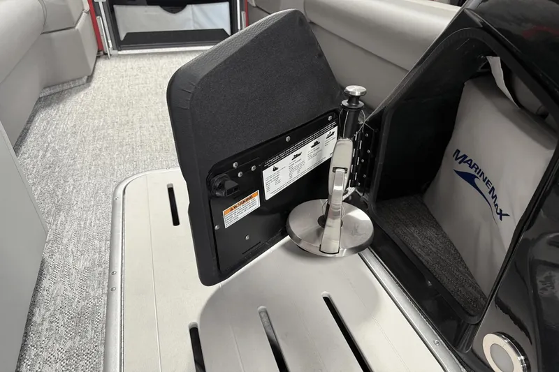 Slide: The Image of 2024 Premier 250 Solaris boat interior with MarineMax storage compartment. - 30