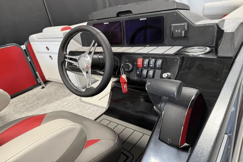 Slide: The Image of 2024 Premier 250 Solaris boat dashboard with steering wheel and control panel. - 33