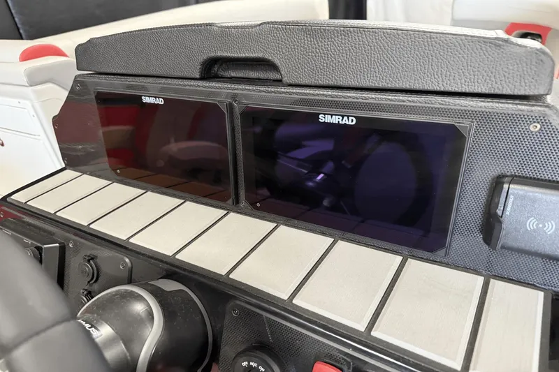 Slide: The Image of 2024 Premier 250 Solaris dashboard with dual Simrad displays. - 35