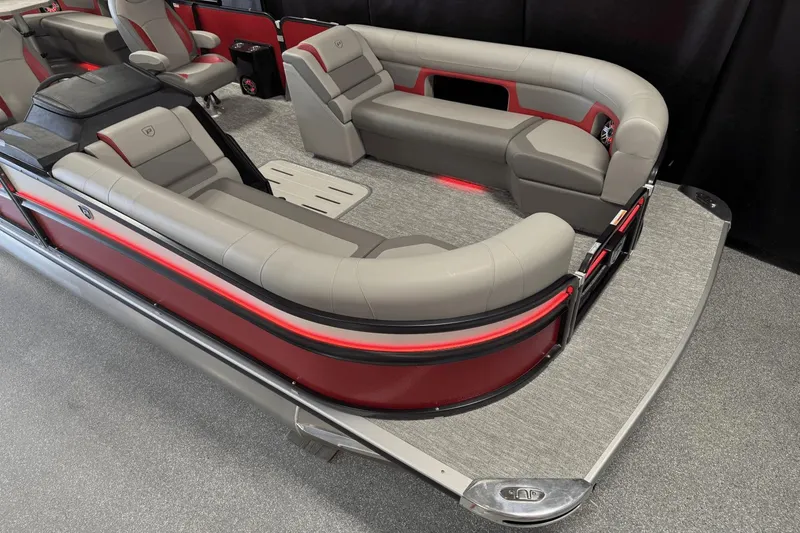Slide: The Image of 2024 Premier 250 Solaris pontoon boat interior with luxurious seating and modern design. - 4