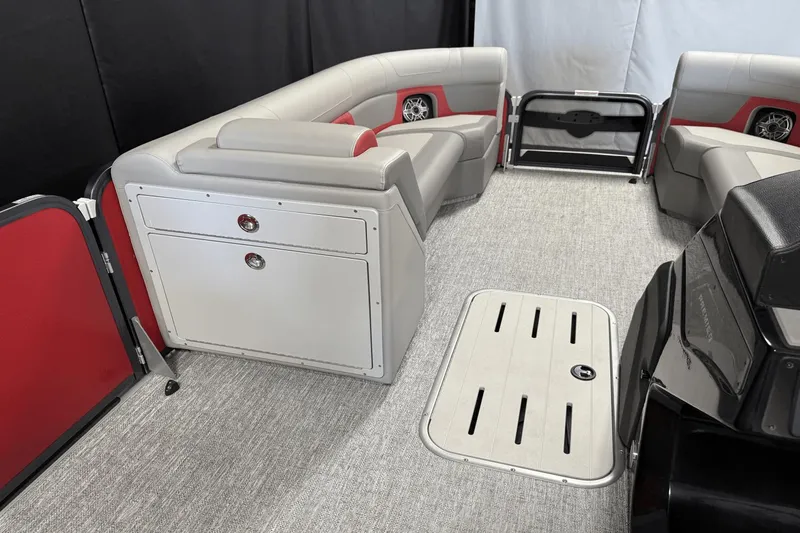 Slide: The Image of 2024 Premier 250 Solaris boat interior with gray seating and red accents. - 42