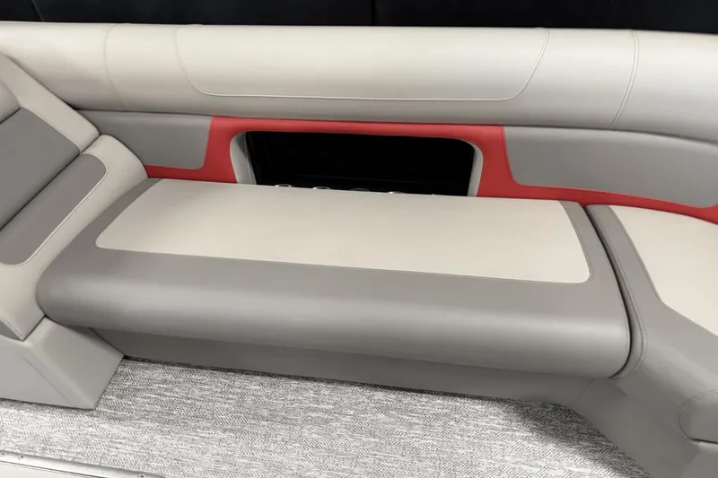 Slide: The Image of 2024 Premier 250 Solaris boat seating, featuring gray and red upholstery with modern design. - 46