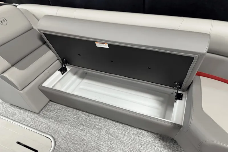 Slide: The Image of Open storage compartment in 2024 Premier 250 Solaris boat seat. - 48