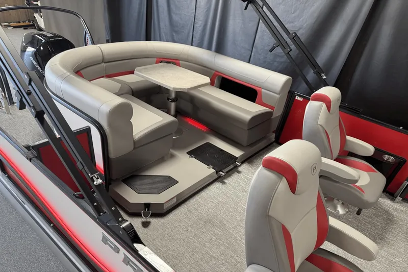 Slide: The Image of 2024 Premier 250 Solaris boat interior with plush seating and table, featuring modern design elements. - 8