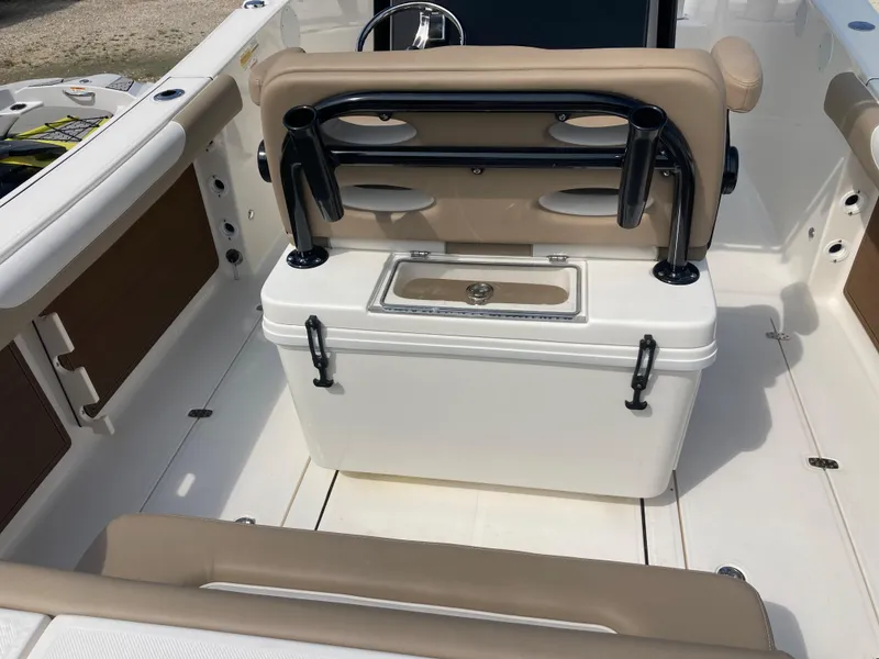 Slide: The Image of 2024 Sea Born SX239 Offshore boat interior with seating and storage. - 5