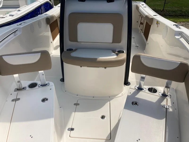 Slide: The Image of 2024 Sea Born SX239 Offshore boat interior with seating and storage compartments. - 6