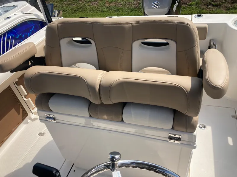 Slide: The Image of 2024 Sea Born SX239 Offshore boat with beige cushioned seating. - 8