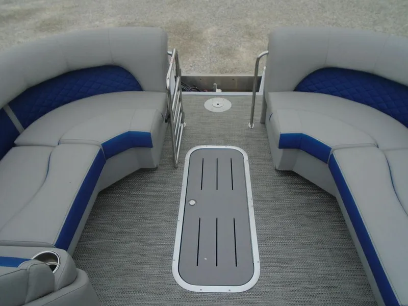Slide: The Image of 2024 Bennington 23 LTFB boat interior with gray and blue seating. - 10