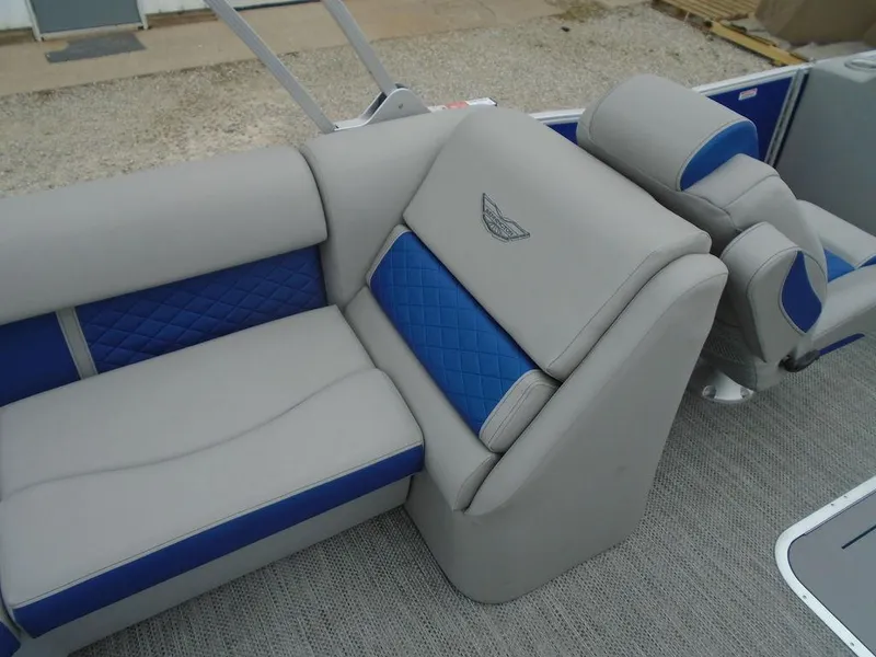 Slide: The Image of 2024 Bennington 23 LTFB boat interior with gray and blue cushioned seating. - 11