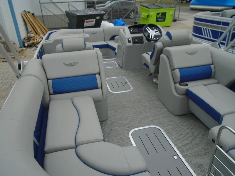 Slide: The Image of 2024 Bennington 23 LTFB pontoon boat interior with gray and blue seating. - 12
