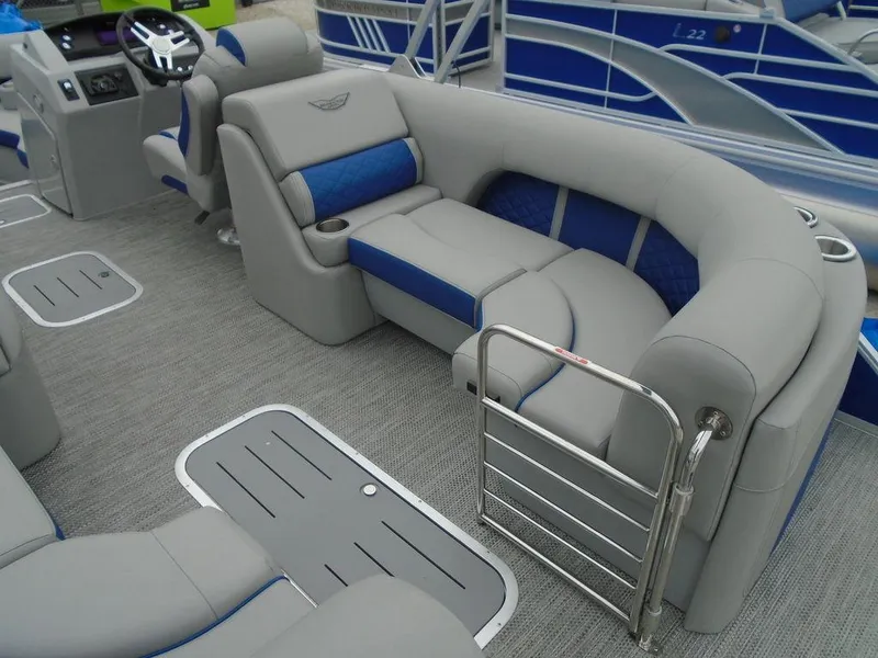 Slide: The Image of 2024 Bennington 23 LTFB pontoon boat interior with gray and blue seating. - 13