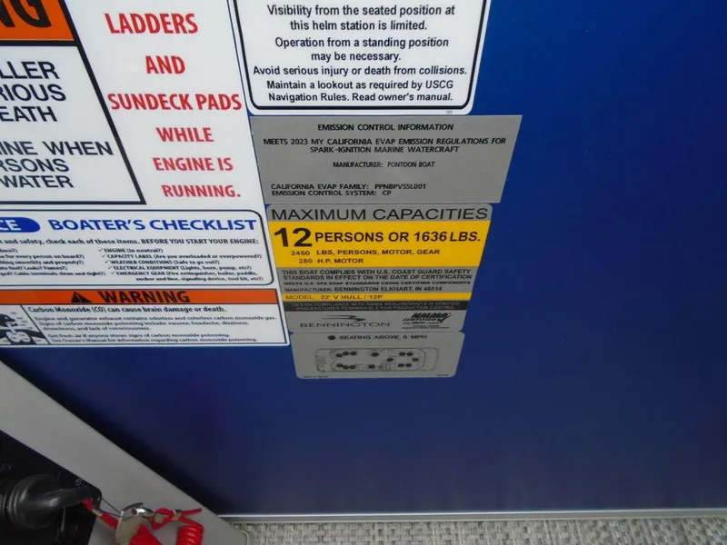 Slide: The Image of 2024 Bennington 23 LTFB boat capacity and safety labels, maximum 12 persons or 1636 lbs. - 16