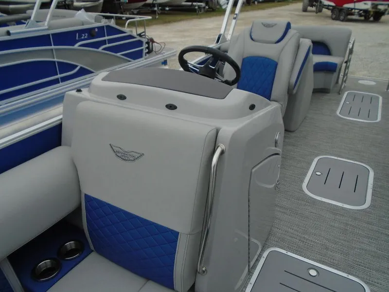Slide: The Image of 2024 Bennington 23 LTFB pontoon boat interior with blue and gray seating. - 19