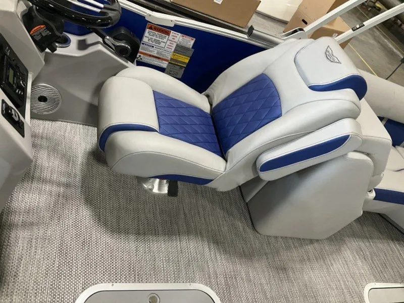 Slide: The Image of 2024 Bennington 23 LTFB boat interior with blue and gray captain's chair. - 4