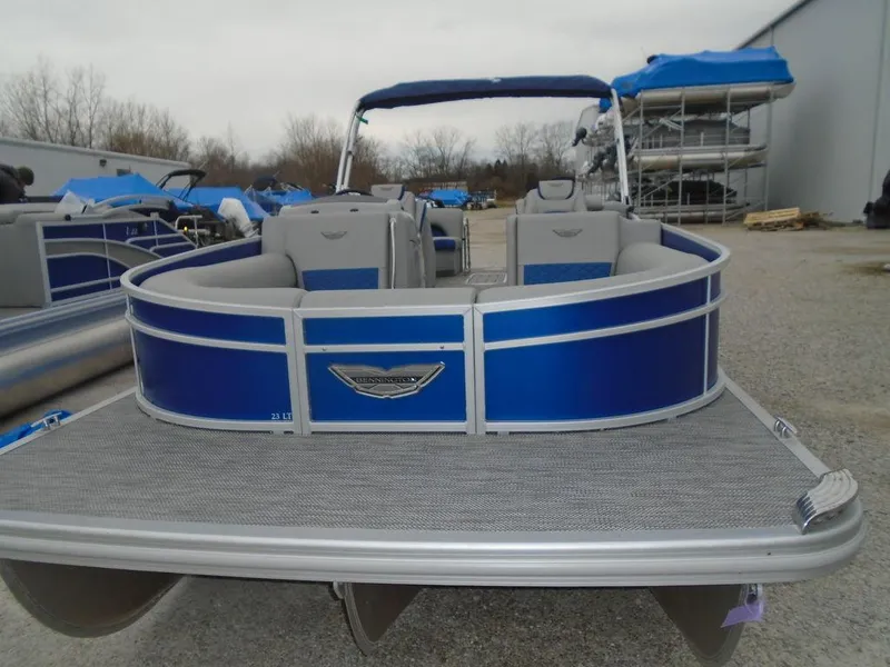 Slide: The Image of 2024 Bennington 23 LTFB pontoon boat with blue and silver accents. - 6