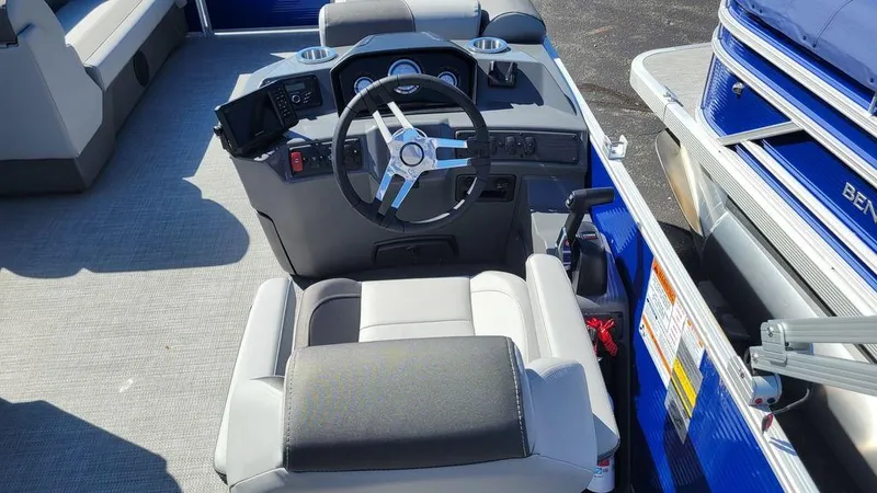 Slide: The Image of 2023 Bennington 20 SVL boat interior with steering wheel and captain's chair. - 4