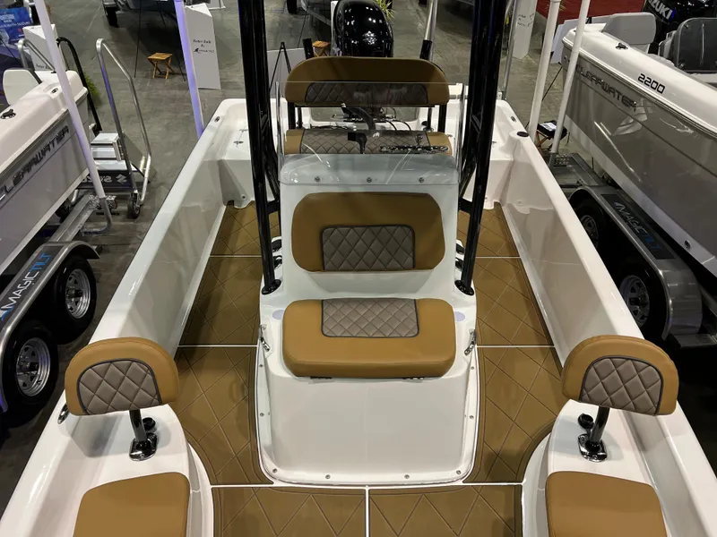 Slide: The Image of 2024 Clearwater 2100 Baystar boat interior with tan and diamond-stitched seating. - 11