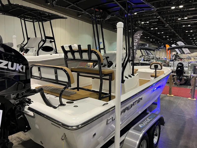 Slide: The Image of 2024 Clearwater 2100 Baystar boat on display with Suzuki outboard motor. - 18