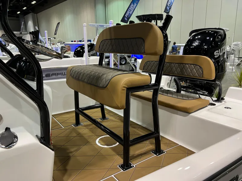 Slide: The Image of 2024 Clearwater 2100 Baystar boat interior with cushioned seating and Suzuki outboard motor. - 3