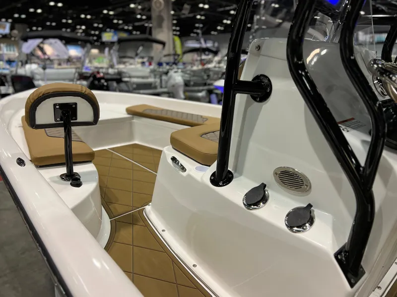 Slide: The Image of 2024 Clearwater 2100 Baystar boat interior at a boat show. - 5