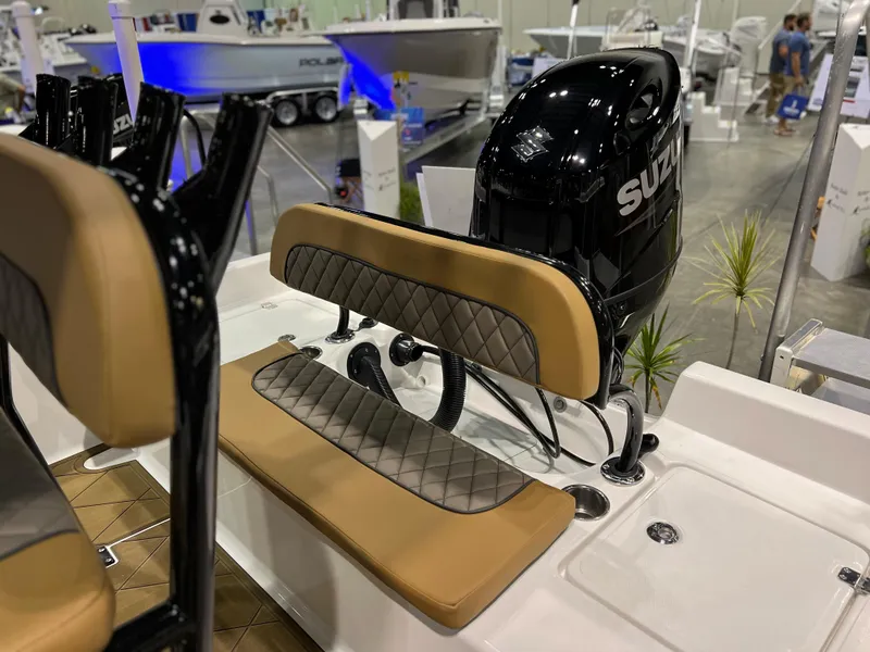 Slide: The Image of 2024 Clearwater 2100 Baystar boat with Suzuki outboard motor at a boat show. - 7