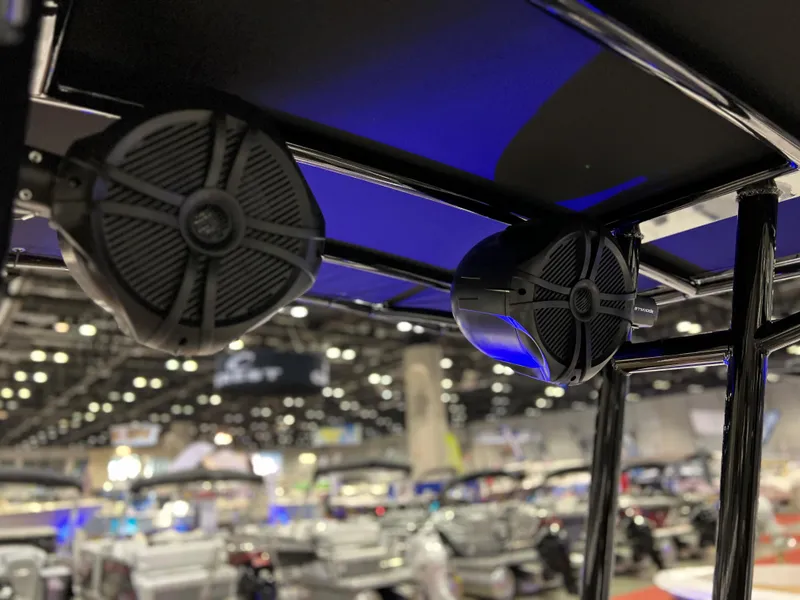 Slide: The Image of Close-up of 2024 Clearwater 2100 Baystar boat speakers at a boat show. - 9