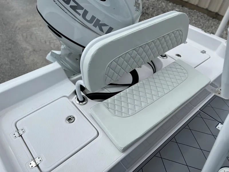 Slide: The Image of 2024 Clearwater 2100 Baystar boat with Suzuki engine and white cushioned seating. - 13